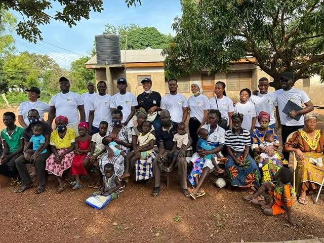 Maltiti Foundation volunteers with community members during an outreach visit